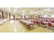 Large community room with numerous tables and chairs at 5660 80Th N St # C307, St Petersburg, FL 33709