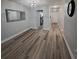 Modern dining room with hardwood floors and a view of the kitchen at 5660 80Th N St # C307, St Petersburg, FL 33709