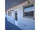 Unit entrance with a white door at 5660 80Th N St # C307, St Petersburg, FL 33709