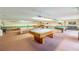 Well-lit game room featuring multiple billiard tables at 5660 80Th N St # C307, St Petersburg, FL 33709