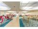 Community game room with various tables and chairs at 5660 80Th N St # C307, St Petersburg, FL 33709