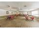 Community game room with tables and chairs at 5660 80Th N St # C307, St Petersburg, FL 33709