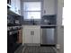 Stainless steel appliances and white shaker cabinets in kitchen at 5660 80Th N St # C307, St Petersburg, FL 33709