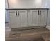 White cabinets and quartz countertop in laundry room at 5660 80Th N St # C307, St Petersburg, FL 33709