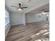 Bright living room with wood-look floors and ceiling fan at 5660 80Th N St # C307, St Petersburg, FL 33709