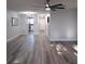 Sunlit living room showcasing hardwood floors and an open floor plan at 5660 80Th N St # C307, St Petersburg, FL 33709