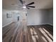 Open living room with wood-look floors and lots of natural light at 5660 80Th N St # C307, St Petersburg, FL 33709