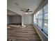 Bright living room with ceiling fan and large windows at 5660 80Th N St # C307, St Petersburg, FL 33709