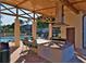 Community outdoor kitchen with grill and seating area at 5660 80Th N St # C307, St Petersburg, FL 33709