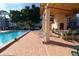 Community pool with patio furniture and grill at 5660 80Th N St # C307, St Petersburg, FL 33709