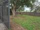Spacious backyard with a large tree and wooden fence at 5902 18Th St, Zephyrhills, FL 33542