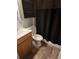 Small bathroom with shower and wood vanity at 5902 18Th St, Zephyrhills, FL 33542