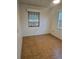 Simple bedroom with tiled floor and window at 5902 18Th St, Zephyrhills, FL 33542