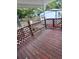 Back deck with lattice railings and wooden flooring at 5902 18Th St, Zephyrhills, FL 33542