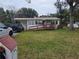 Ranch-style home with carport and ramp at 5902 18Th St, Zephyrhills, FL 33542