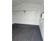 Clean and empty shed interior with wire shelving at 5902 18Th St, Zephyrhills, FL 33542
