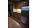 Galley kitchen with wood cabinets and appliances at 5902 18Th St, Zephyrhills, FL 33542