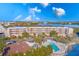 Aerial view of waterfront condo community with pool and lush landscaping at 6315 Shoreline Dr # 3202, St Petersburg, FL 33708