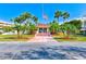Community building with landscaping and flagpole at 6315 Shoreline Dr # 3202, St Petersburg, FL 33708