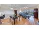 Dining area with dark wood table, grey chairs, and open concept layout at 6315 Shoreline Dr # 3202, St Petersburg, FL 33708