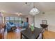 Open dining area with table and chairs, adjacent to living room at 6315 Shoreline Dr # 3202, St Petersburg, FL 33708