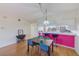 Dining area with pink accent wall and kitchen bar at 6315 Shoreline Dr # 3202, St Petersburg, FL 33708