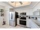 Modern kitchen with stainless steel appliances and white cabinets at 6315 Shoreline Dr # 3202, St Petersburg, FL 33708