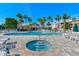 Community pool and spa with lounge chairs and patio area at 6315 Shoreline Dr # 3202, St Petersburg, FL 33708