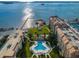 Aerial view showcasing the community pool and waterfront access at 632 Edgewater Dr # 439, Dunedin, FL 34698