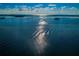 Aerial view of calm water with subtle waves and sunlight reflecting on the surface at 632 Edgewater Dr # 439, Dunedin, FL 34698