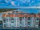 Aerial view of condo building showcasing water access and building features at 632 Edgewater Dr # 439, Dunedin, FL 34698