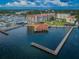 Aerial view of waterfront community with docks and clubhouse at 632 Edgewater Dr # 439, Dunedin, FL 34698