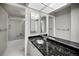 Bathroom with granite countertop and double sinks at 632 Edgewater Dr # 439, Dunedin, FL 34698