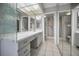 Main bathroom with double vanity and shower at 632 Edgewater Dr # 439, Dunedin, FL 34698