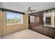 Bedroom with window, ceiling fan and built-in unit at 632 Edgewater Dr # 439, Dunedin, FL 34698