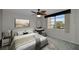 Spacious bedroom with a ceiling fan and large window at 632 Edgewater Dr # 439, Dunedin, FL 34698