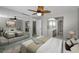 Bright bedroom with mirrored closet and ceiling fan at 632 Edgewater Dr # 439, Dunedin, FL 34698