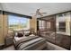 Bedroom with large window, ceiling fan and built-in unit at 632 Edgewater Dr # 439, Dunedin, FL 34698