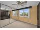Bedroom with mirrored closet and window view at 632 Edgewater Dr # 439, Dunedin, FL 34698