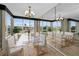 Elegant dining room with large windows and a chandelier at 632 Edgewater Dr # 439, Dunedin, FL 34698