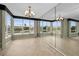 Bright dining room with large windows and mirrored walls at 632 Edgewater Dr # 439, Dunedin, FL 34698