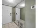 Condo entryway with mirrored wall and tiled floors at 632 Edgewater Dr # 439, Dunedin, FL 34698