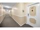 Interior hallway with carpeted floors and apartment doors at 632 Edgewater Dr # 439, Dunedin, FL 34698