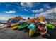 Colorful kayaks are lined up on racks by the water at 632 Edgewater Dr # 439, Dunedin, FL 34698