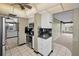 Modern kitchen with stainless steel appliances and white cabinets at 632 Edgewater Dr # 439, Dunedin, FL 34698