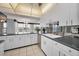 Modern kitchen with stainless steel appliances and white cabinets at 632 Edgewater Dr # 439, Dunedin, FL 34698