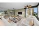 Living room with kitchen view and comfortable seating at 632 Edgewater Dr # 439, Dunedin, FL 34698