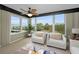 Living room with water views and comfortable seating at 632 Edgewater Dr # 439, Dunedin, FL 34698