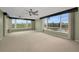 Spacious living room featuring large windows and neutral decor at 632 Edgewater Dr # 439, Dunedin, FL 34698