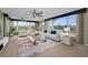 Bright living room with large windows and furnished with sofas at 632 Edgewater Dr # 439, Dunedin, FL 34698